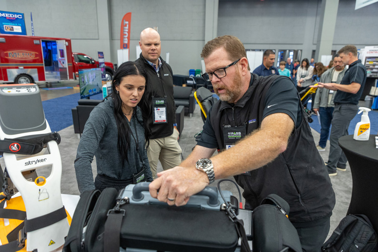 exhibitor demonstrating product features to attendee | Texas EMS Conference