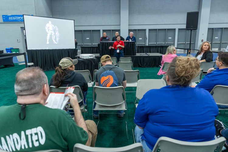 Exhibitor speaking about current products at product spotlight in exhibit hall. | Texas EMS Conference